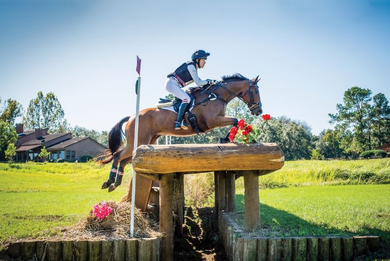 Lainey Ashker jumping horse